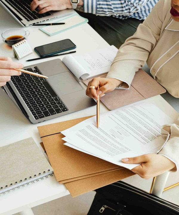 Insurance advisor discussing financial documents with a client during consultation